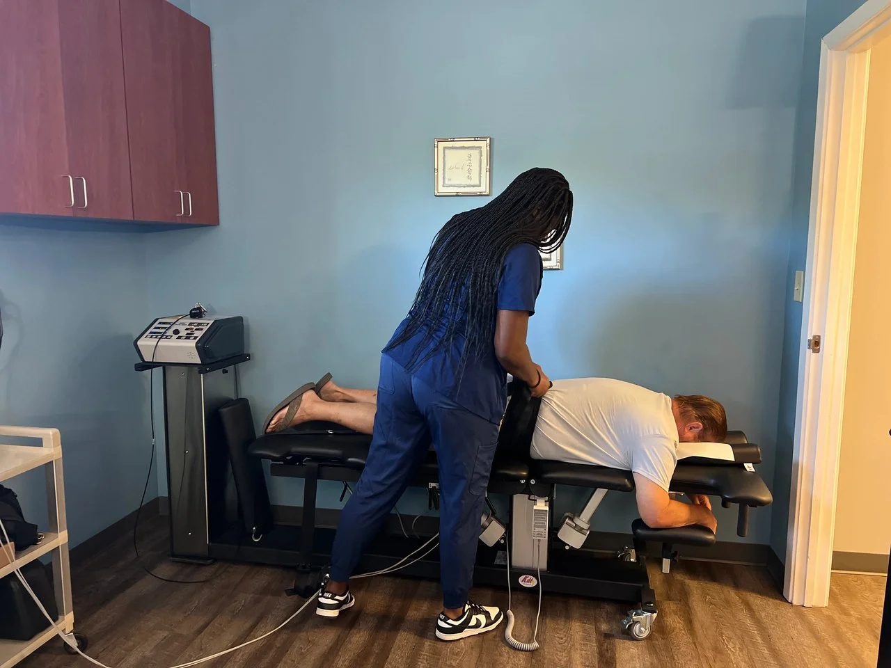 A ProWellness team member provides hands-on low back therapy to a patient at the Lincolnton clinic